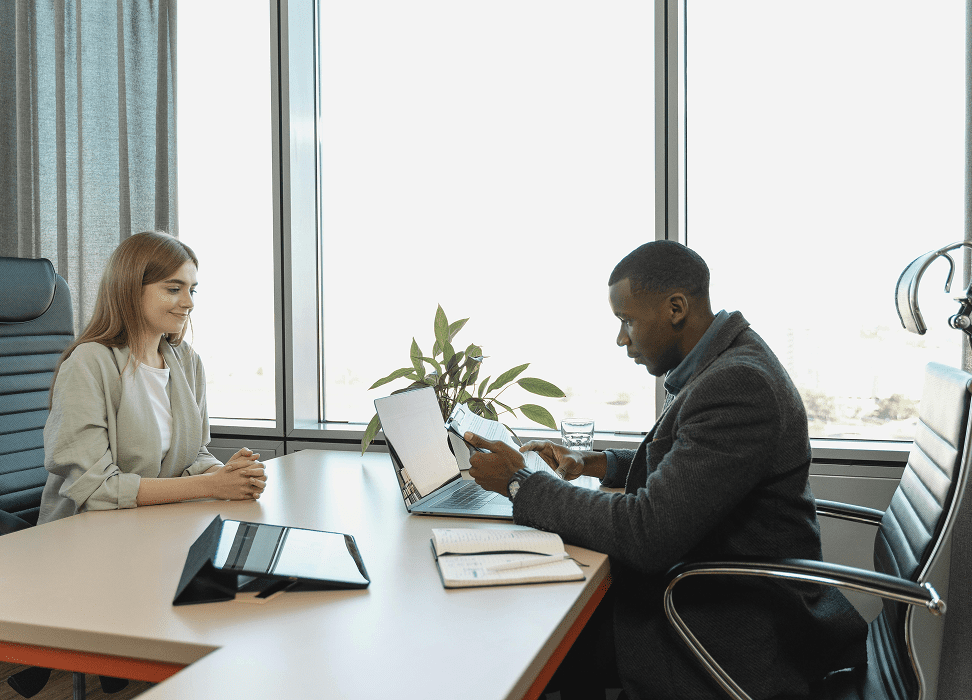 Two colleagues collaborating at table