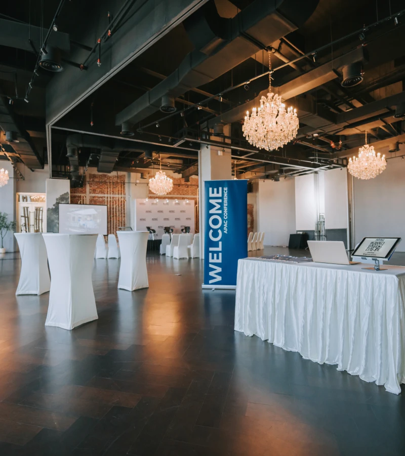 Event venue with chandeliers and welcome sign