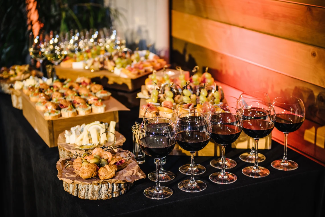 Wine glasses and assorted appetizers on table